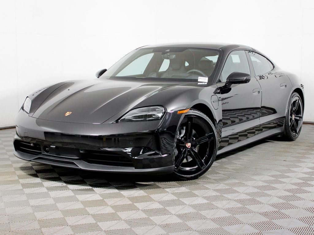 2026 Porsche Taycan 4 in Jet Black Metallic — front three-quarter view